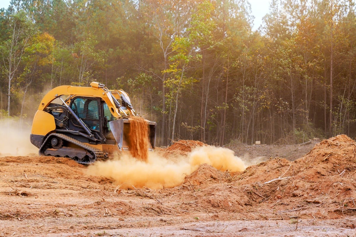 Skid steer working on a construction site